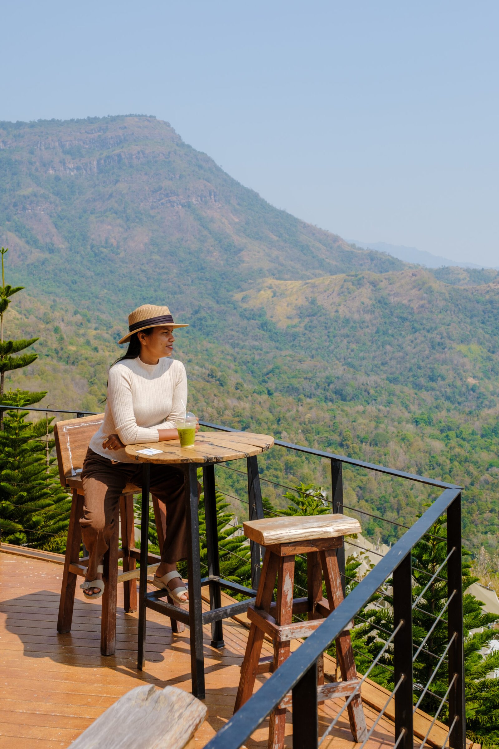 women drinking Thai tea in a cafe in the mountains of Phetchabun Kha Kho Thailand.