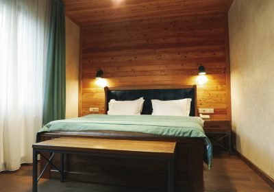 Double bed in apartments of cozy hotel